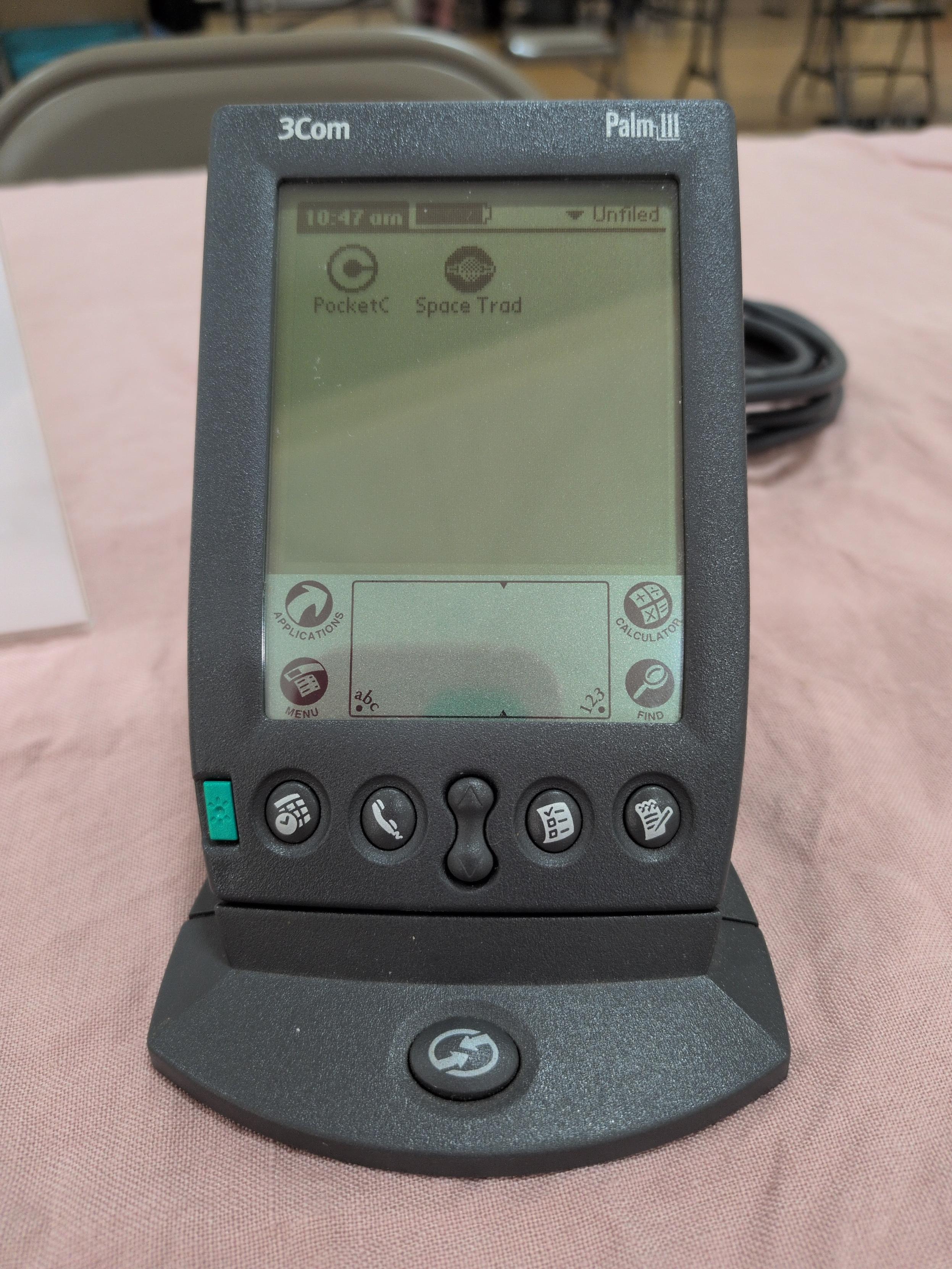 The Palm III, showing installed the applications PocketC and Space Trader